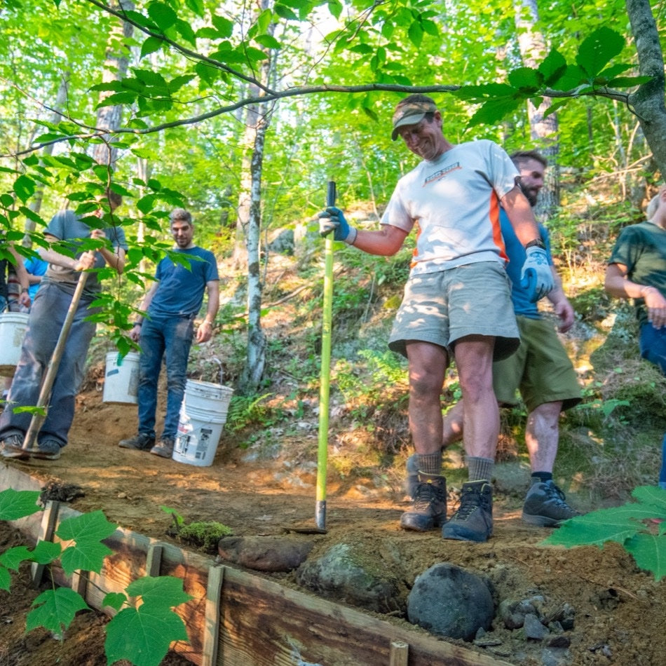 Volunteers working on fixing a mountain bike trail in Vermont