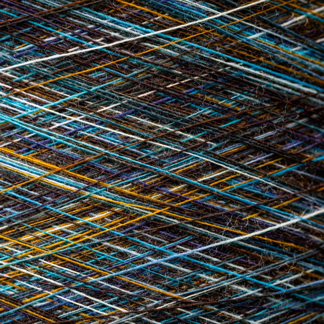 Close up of Darn Tough yarns used to knit our socks in a cross stretch.