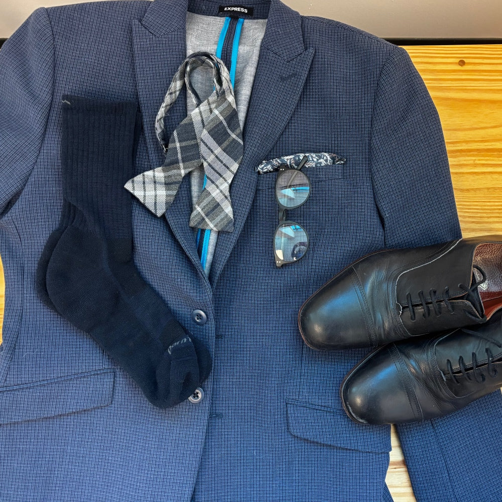 A blue suit with matching blue dress socks and accessories