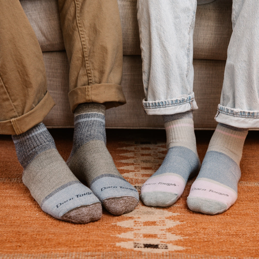 Two sets of feet in coordinated Merino Wool socks, the warmest socks from Darn Tough