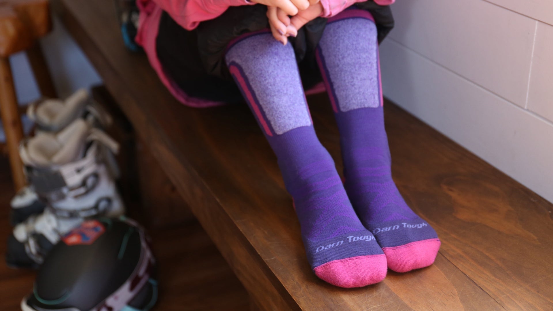 models feet on bench wearing the kids' T-Bar in grape 
