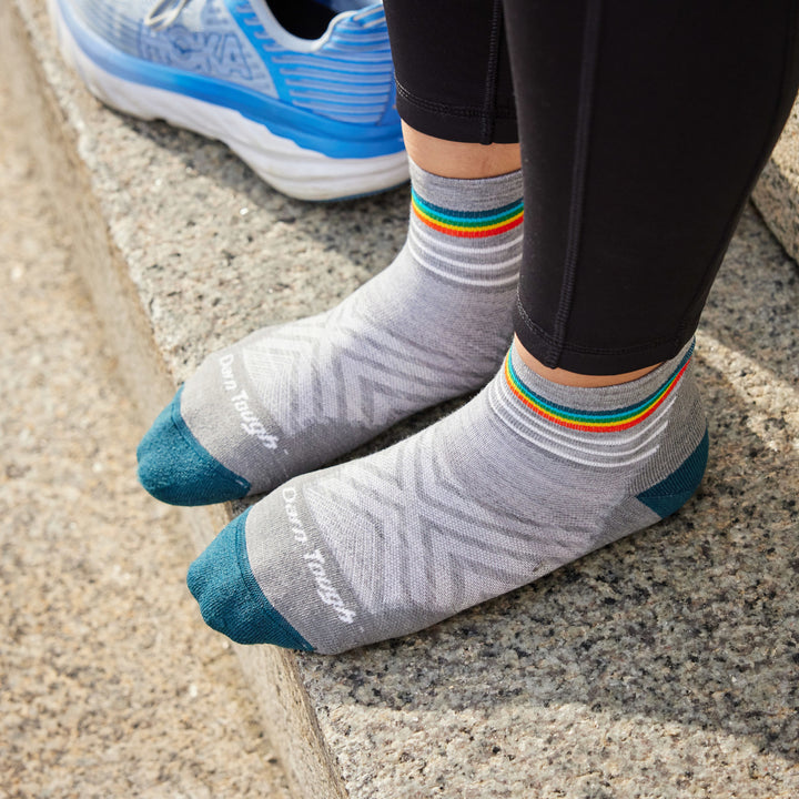 Models feet on granite step wearing the 1048 Quarter run in Gray 