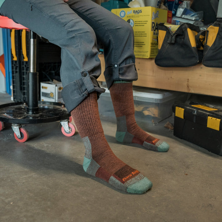 Model sitting on a shop seat showing the full 2014 RTR Work sock in Rosewood