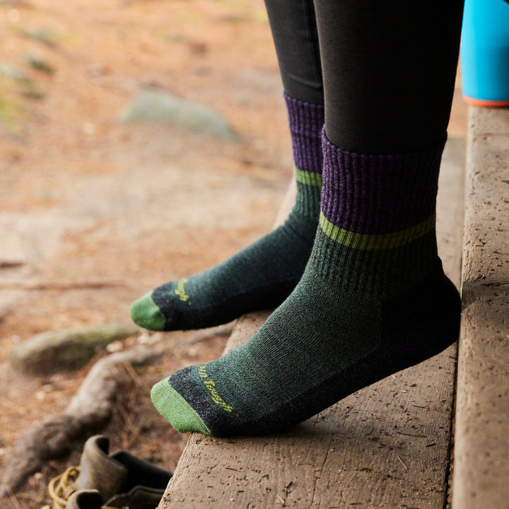 close up of model with feet on steps wearing the 5002 moss