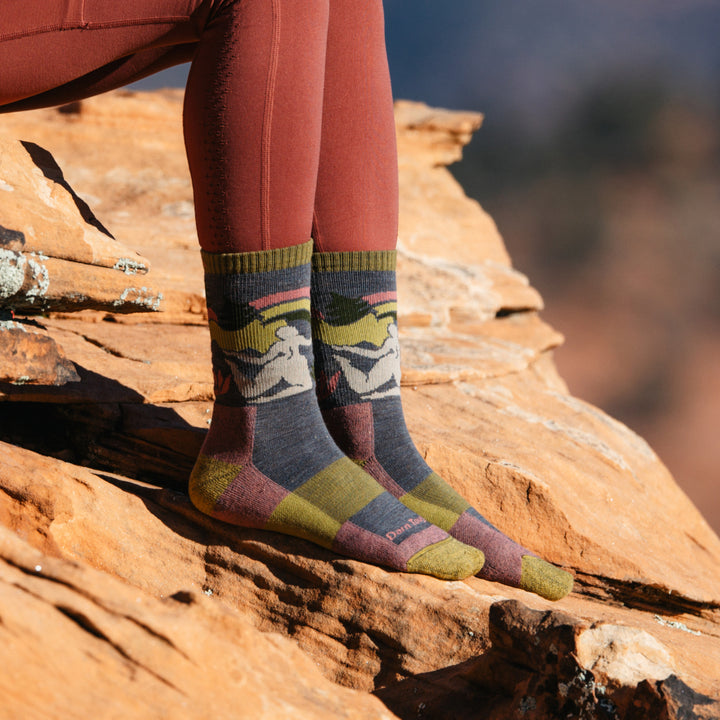 Close up shot of model wearing 5016 socks in Taupe colorway against red desert rock