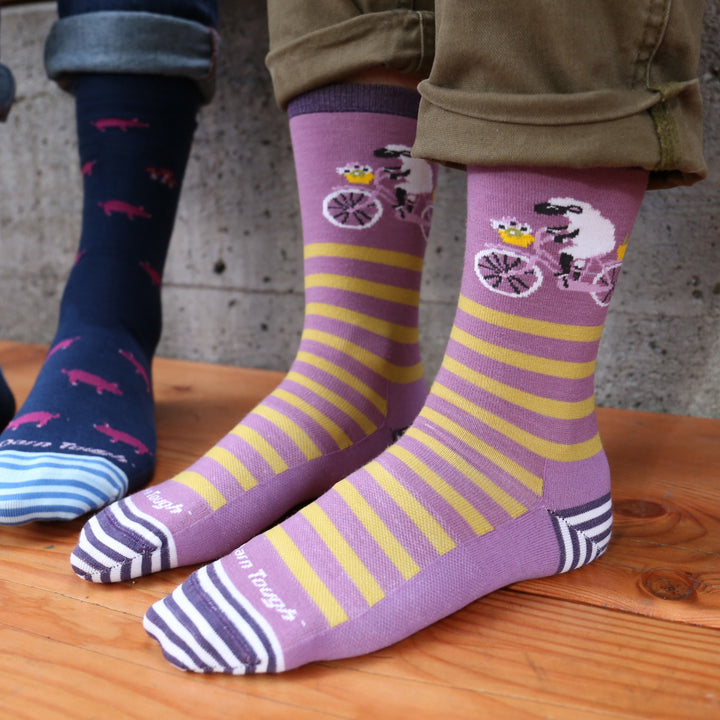 Models feet on wooden floor wearing the 6037 Animal haus Crew Lifestyle sock in Lilac