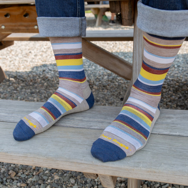 models feet on picnic bench wearing the 6090 druid crew sock in Rye 