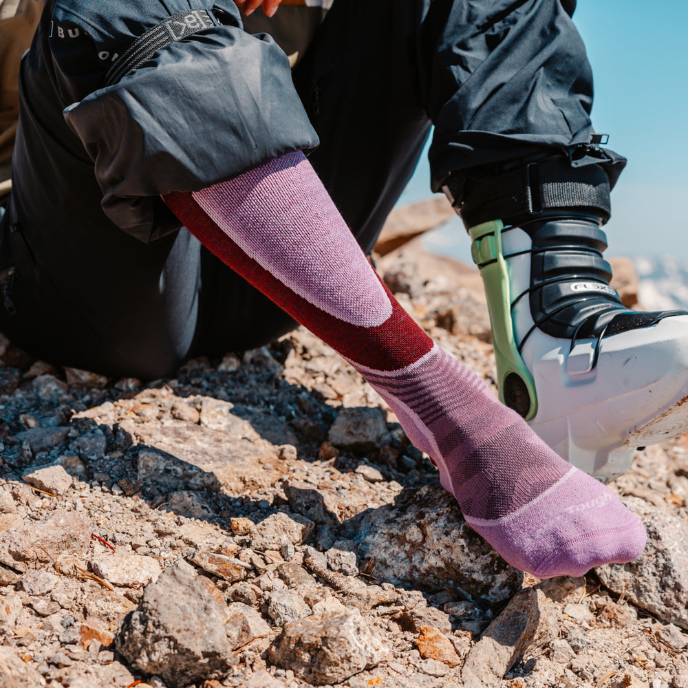 close up on model image of 8038 Burgundy back foot wearing ski boot 