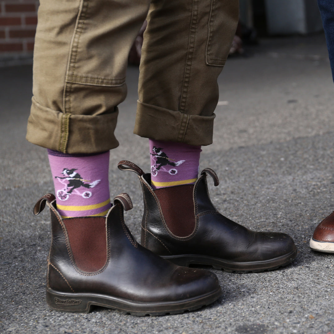 Models feet in ankle boots wearing the 6037 Animal haus crew lifestyle socks in Lilac