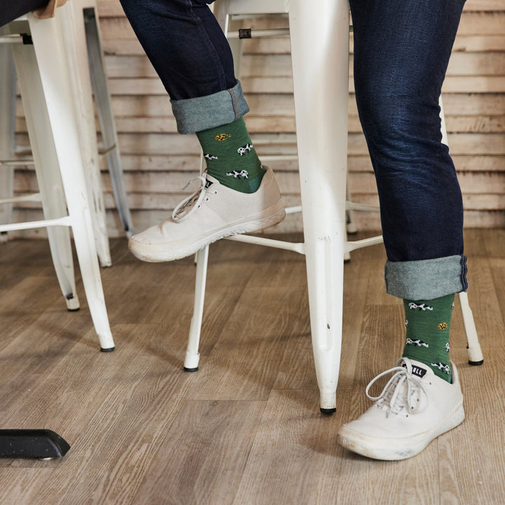 close up of model sitting on stool wearing the 6116 Pasture in sneakers