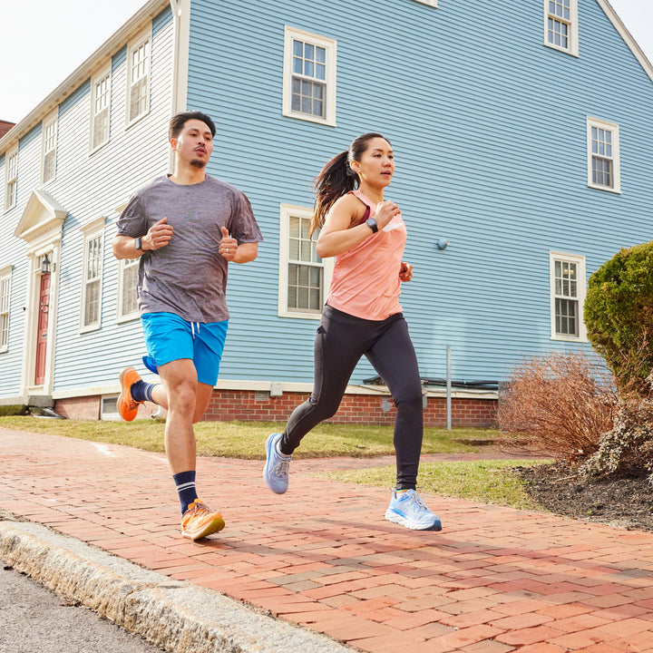 Models running on sidewalk wearing the 1118 Element Micro crew running sock in eclipse