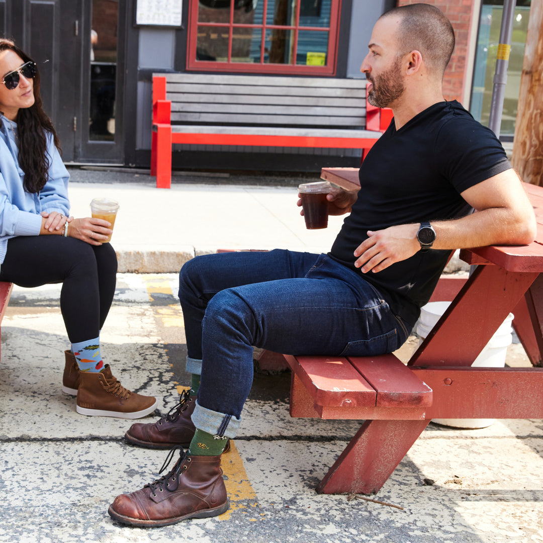 model sitting on picnic table hold a beverage  wearing the 6116 pasture