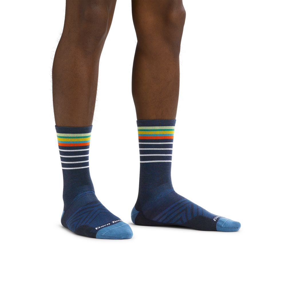 Man standing barefoot wearing Stride Micro Crew Ultra-Lightweight Running Socks in Eclipse