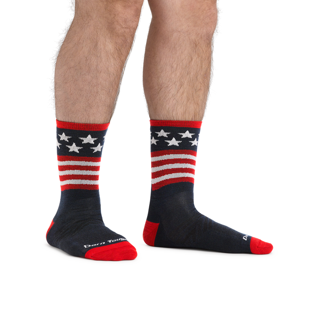 Man standing barefoot wearing Patriot Micro Crew Ultra-Lightweight Running Socks in Stars and Stripes
