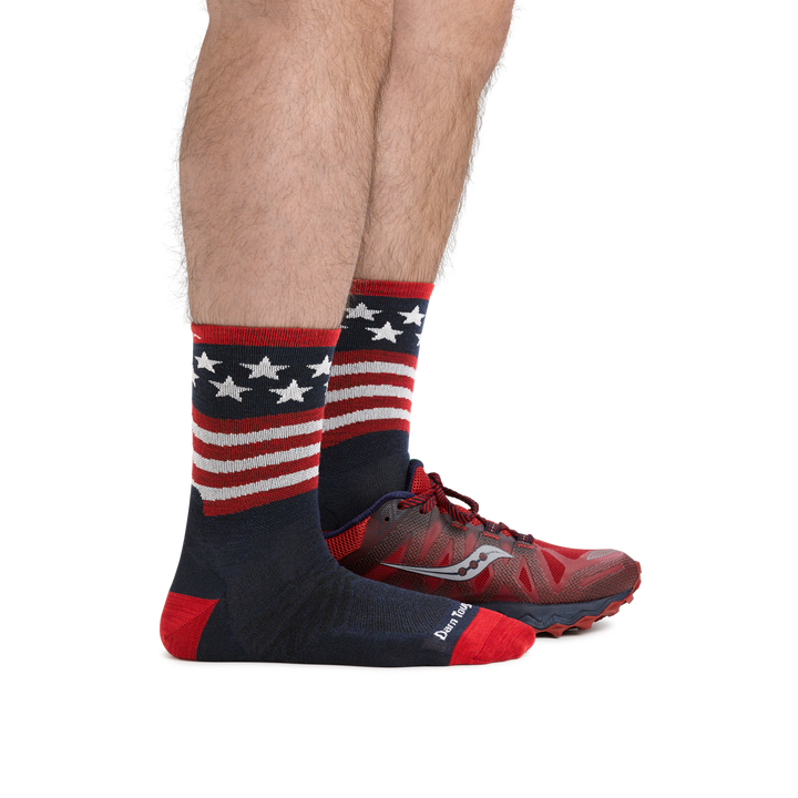 Man wearing Patriot Micro Crew Ultra-Lightweight Running Socks in Stars and Stripes and back foot wearing a running shoe