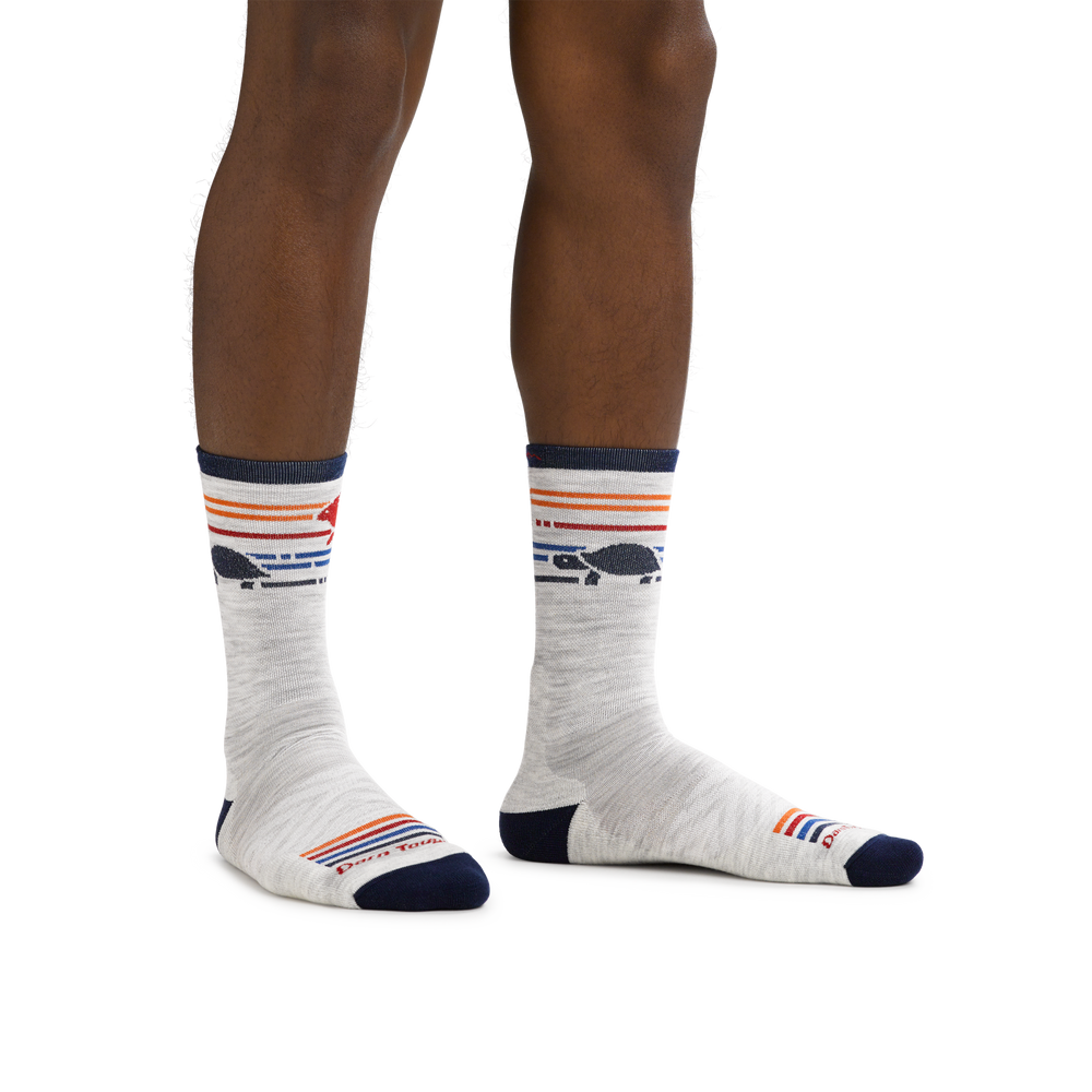 Man standing barefoot wearing Pacer Micro Crew Ultra-Lightweight Running Sock in Ash