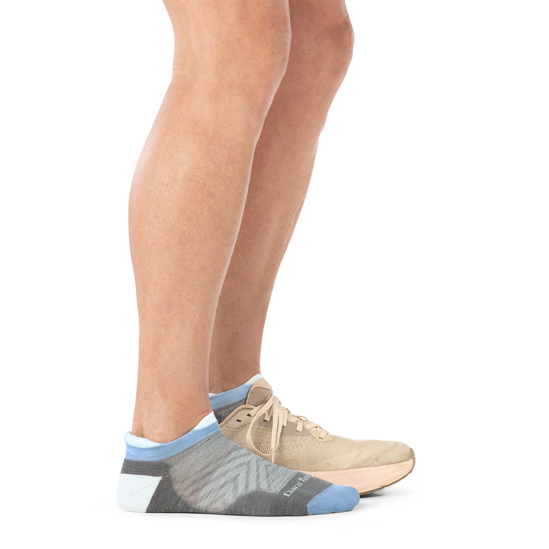 Model wearing shoe on back foot and 1047 No show running sock in silver  side profile