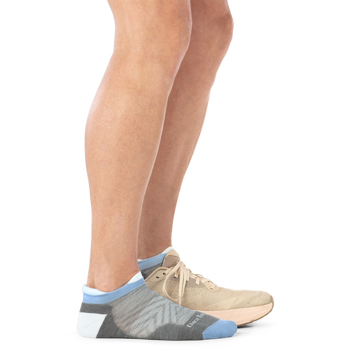 Model wearing shoe on back foot and 1047 No show running sock in silver  side profile