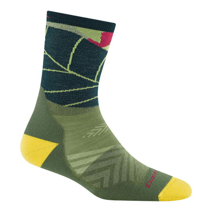1069 run wild micro crew running sock in palm colorway featuring a green body with large leaf on leg yellow heel/toe
