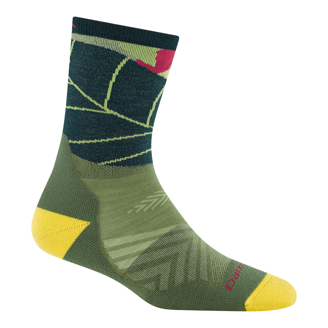1069 run wild micro crew running sock in palm colorway featuring a green body with large leaf on leg yellow heel/toe