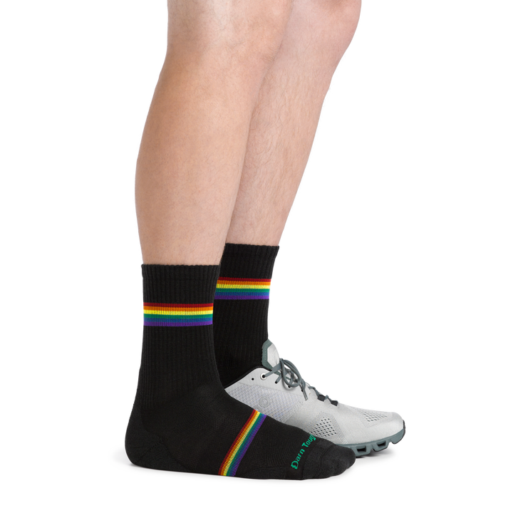 Profile image of Women's Prism Micro Crew Lightweight Running Socks in Black with one foot also in an athletic shoe