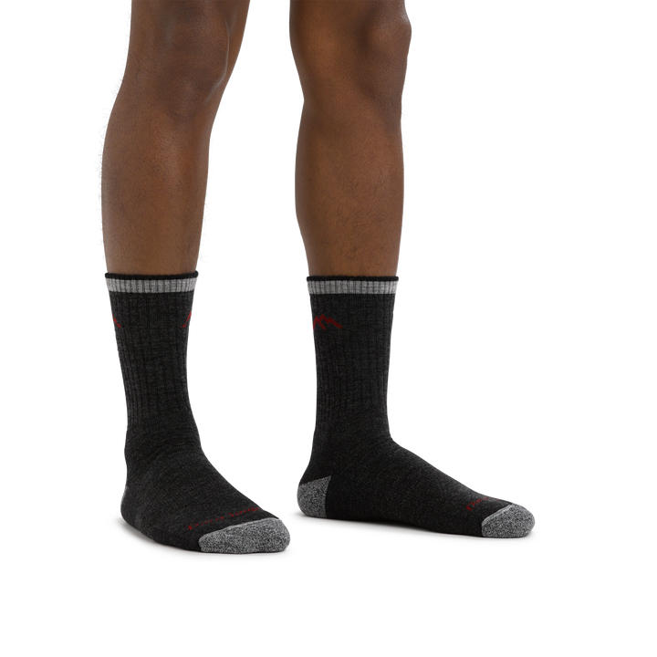 Man standing barefoot wearing Hiker Micro Crew Midweight Hiking Sock in Black