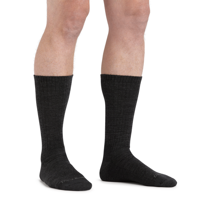 Man standing barefoot wearing The Standard Crew  Lightweight Lifestyle Sock in Charcoal