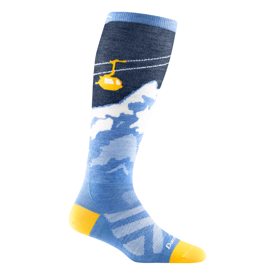 1824 women's yeti over-the-calf ski sock in navy with yellow toe/heel accents, snowy mountain scape and yellow gondola