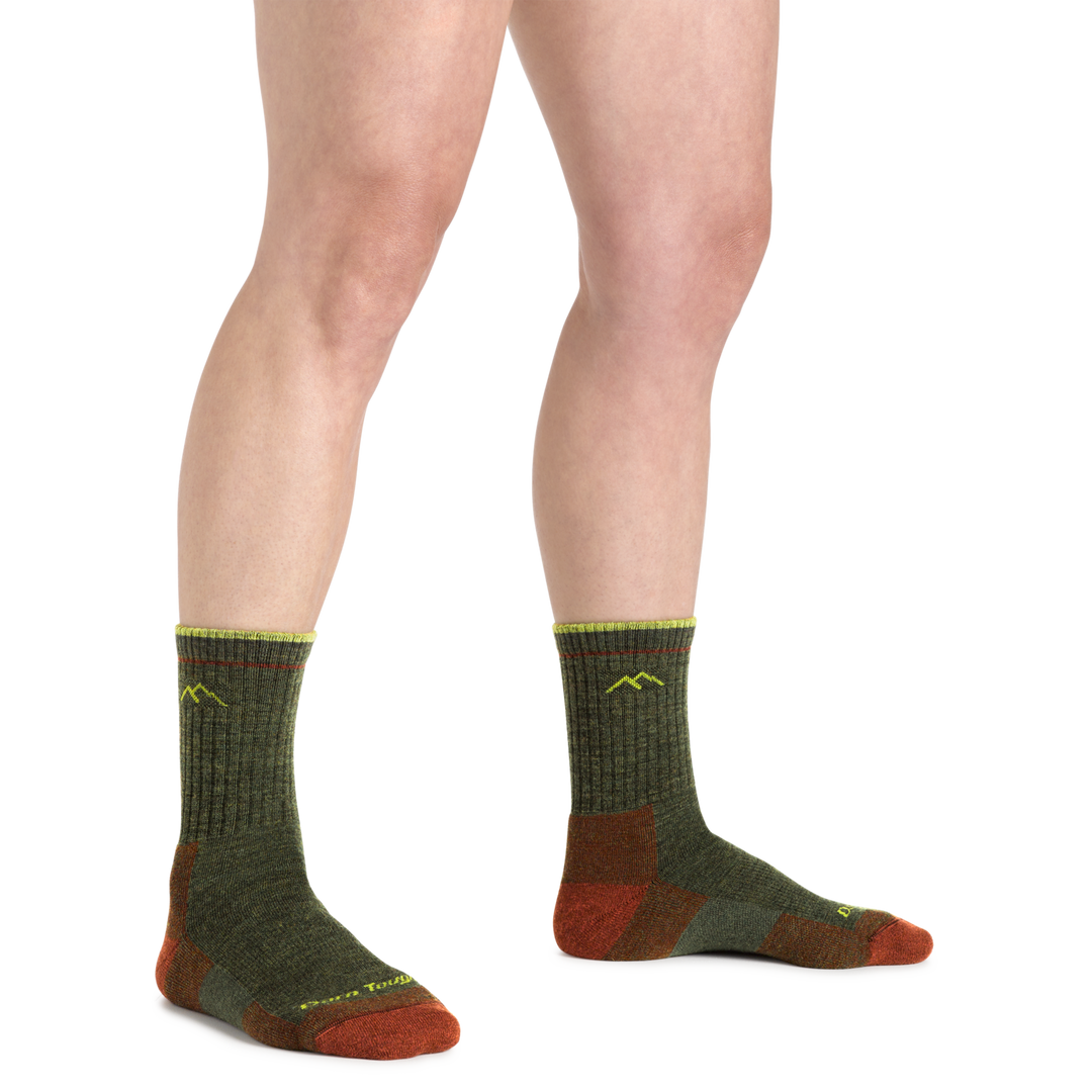 Image of a woman's legs wearing Women's Hiker Micro Crew Midweight Hiking Socks in Forest Colorway