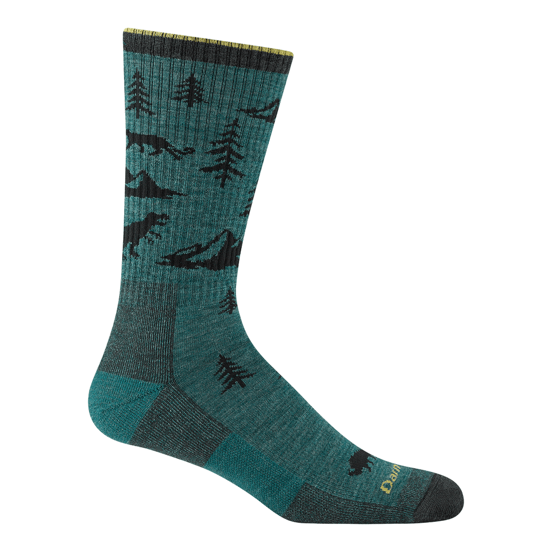 1964 men's ABC boot hiking sock in color teal green with black and yellow accents with forest and animal designs
