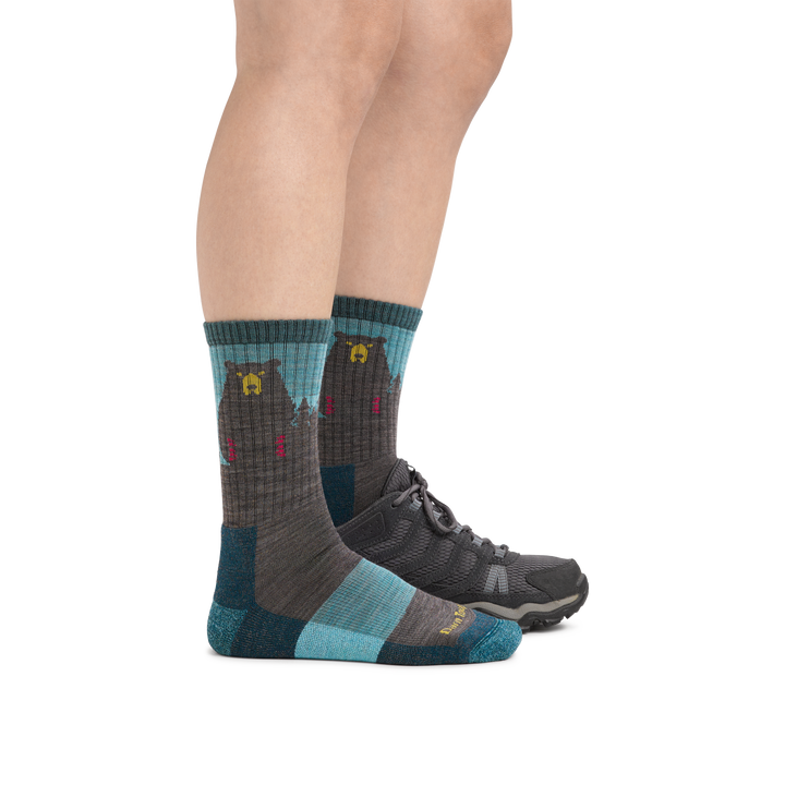 Woman wearing Women's Bear Town Micro Crew Lightweight Hiking Socks in Aqua with back foot also in a hiking shoe