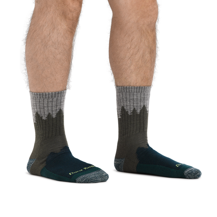 Man standing barefoot wearing Number 2 Micro Crew Hiking Socks in Green