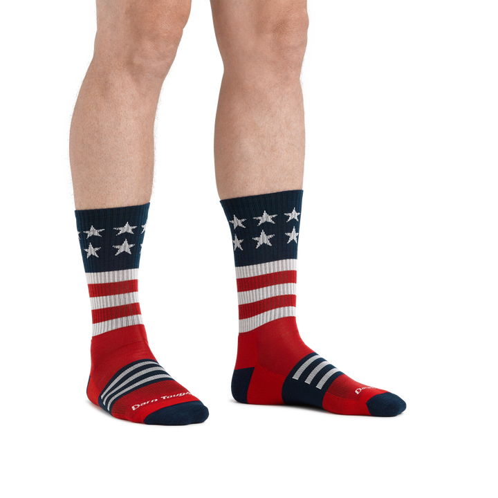 Man standing barefoot wearing Captain Stripe Micro Crew Hiking Sock in Stars and Stripes pattern