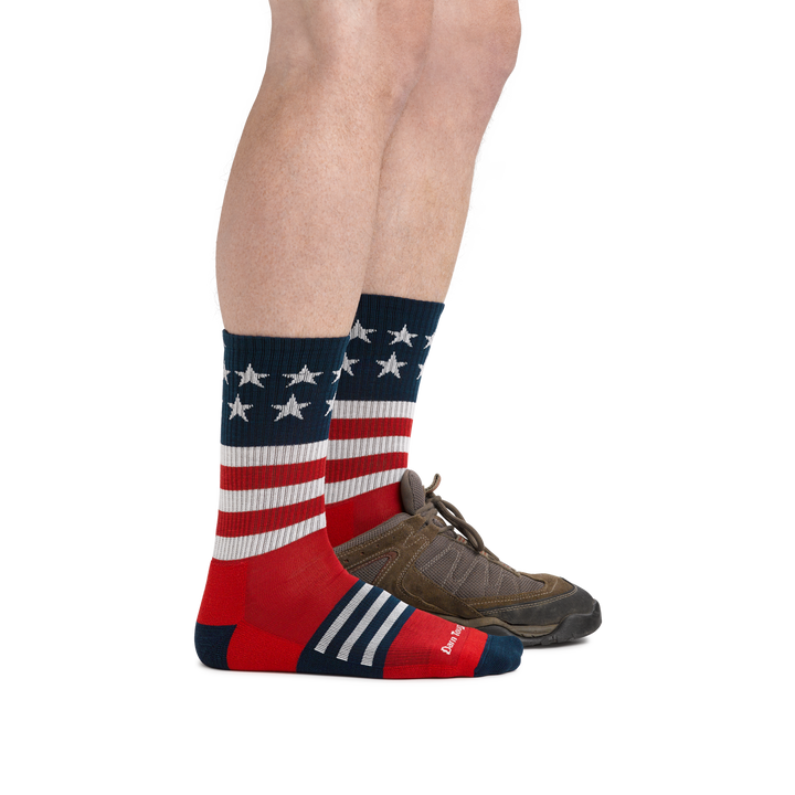 Man wearing the Captain Stripe Micro Crew Hiking sock in Stars and Stripes showing the sock is shin height