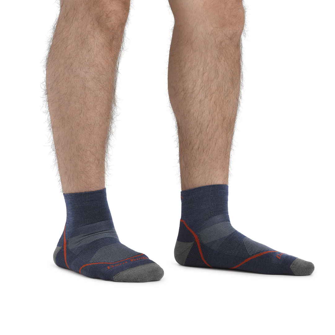 Man standing barefoot wearing Light Hiker Quarter Lightweight Hiking Socks in Denim