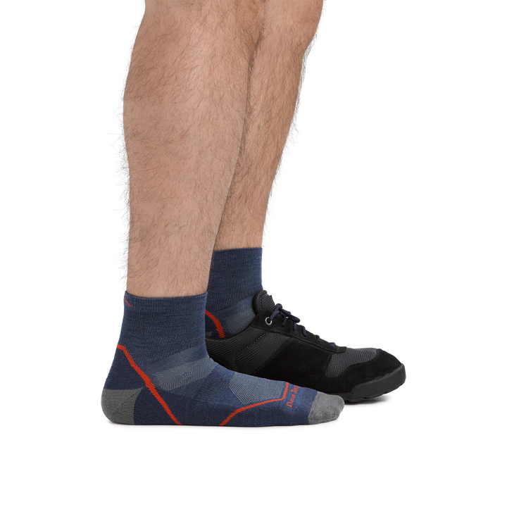 Male legs facing right wearing Light Hiker Quarter Lightweight Hiking Socks in Denim with back foot in a sneaker