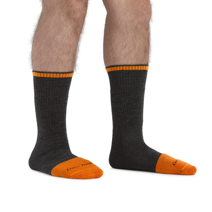 Man standing barefoot wearing Steely Boot Midweight Work Socks in Graphite