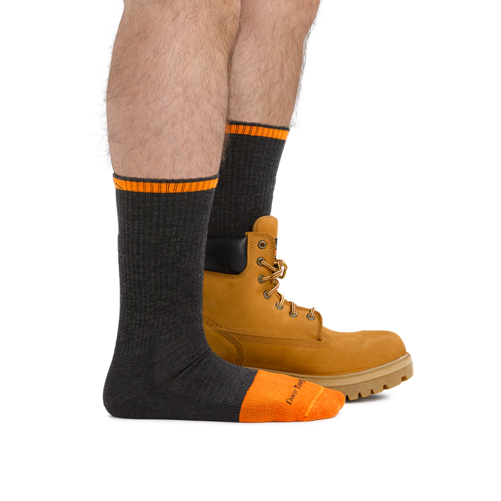 Man wearing Steely Boot Midweight Work Sock in Graphite, back foot also wearing a work boot