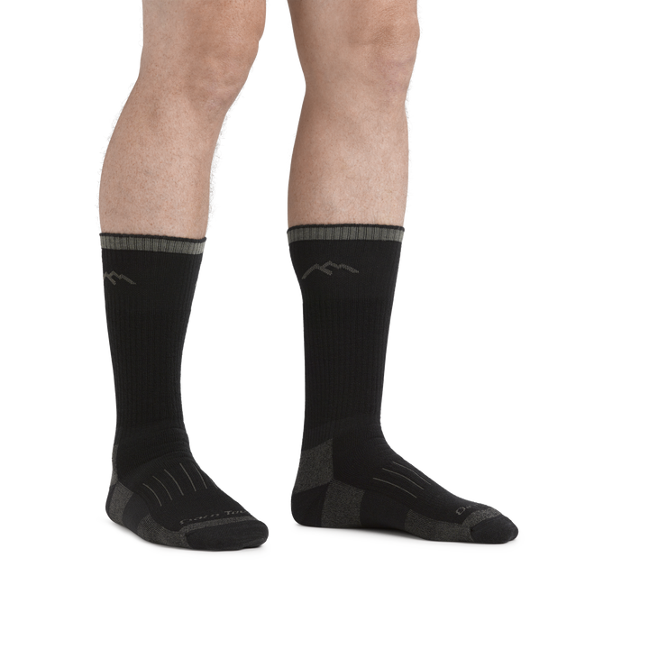 Image of legs on a white background, facing right, wearing Hunter Boot Midweight Hunting Socks in Charcoal