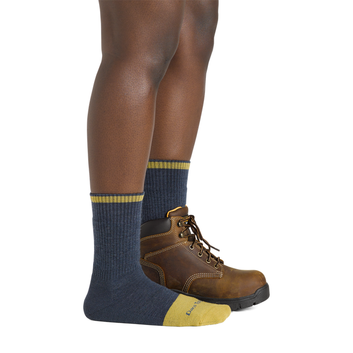 Women's Steely Boot Steel Toe Work Socks in indigo on foot with brown boot on left foot