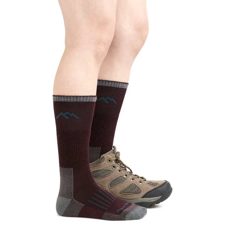 Midweight Women's Hunting Boot Socks in Burgundy on foot with boots