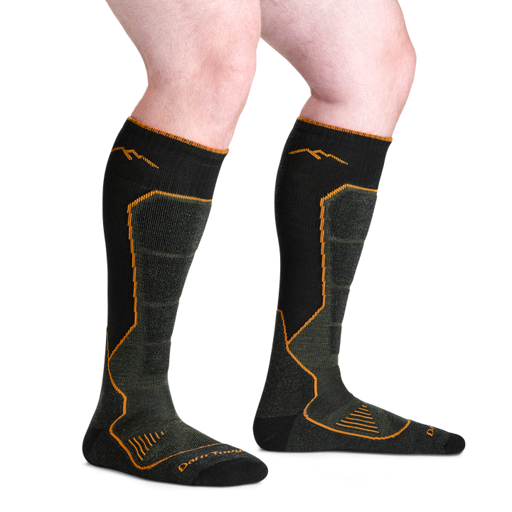 on model image bare foot wearing the 2116 hunting over the calf sock in forest colorway