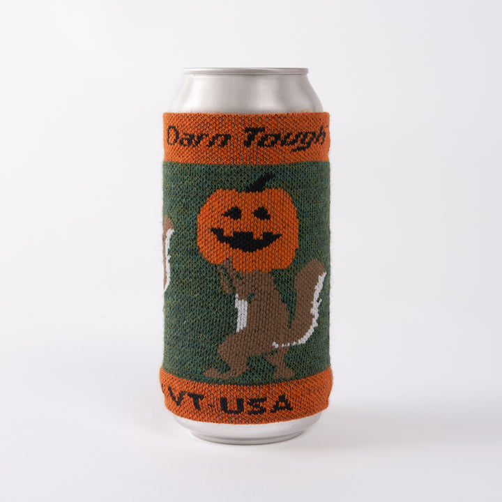 side 1 of Merino Can Sleeve with pumpkin on squirrel head on a can