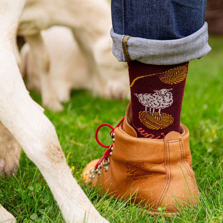 Image of foot in shoe wearing the 6218 in burgundy in the grass 