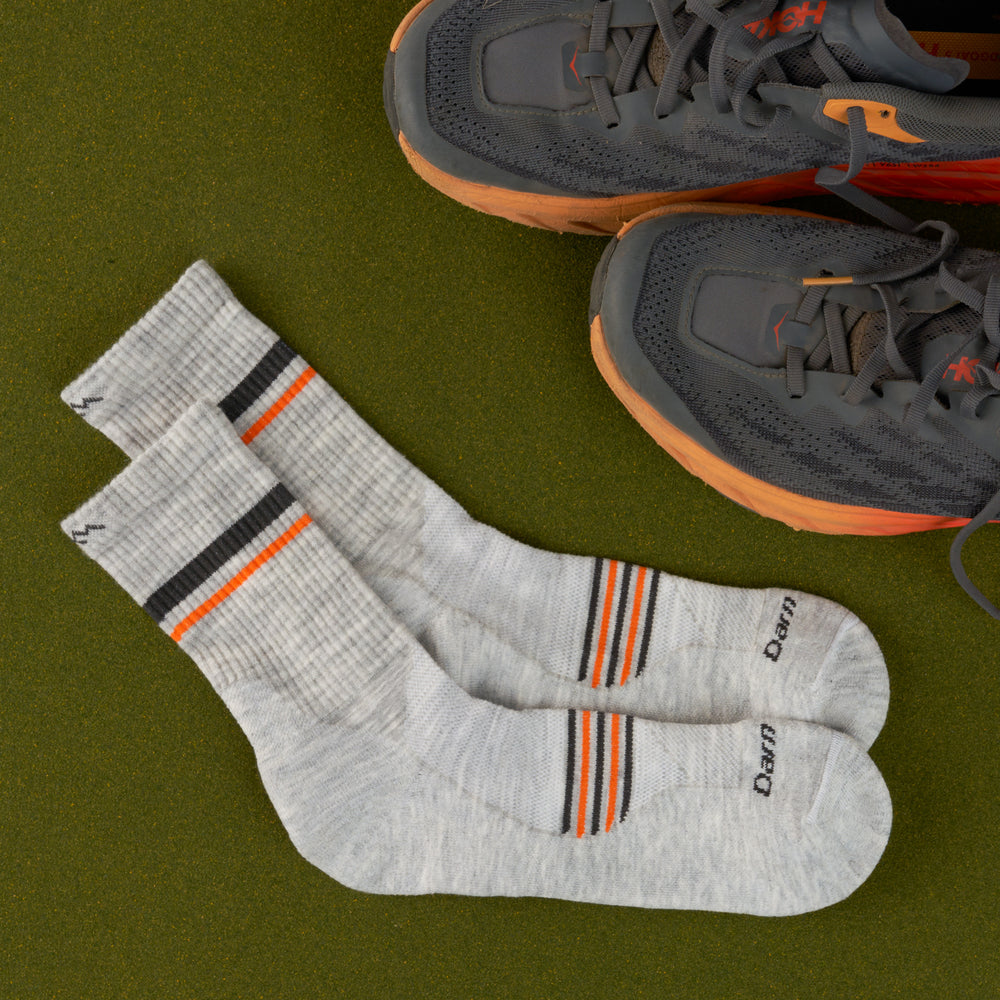 A pair of 1118 Element Micro Crew in Limited edition colorway Ash featuring a navy and orange stripe on the foot and calf