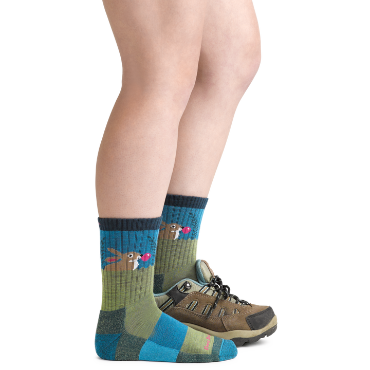 Bubble Bunny Jr. Kids' Hiking Socks in Willow green and blue wearing hiking boot