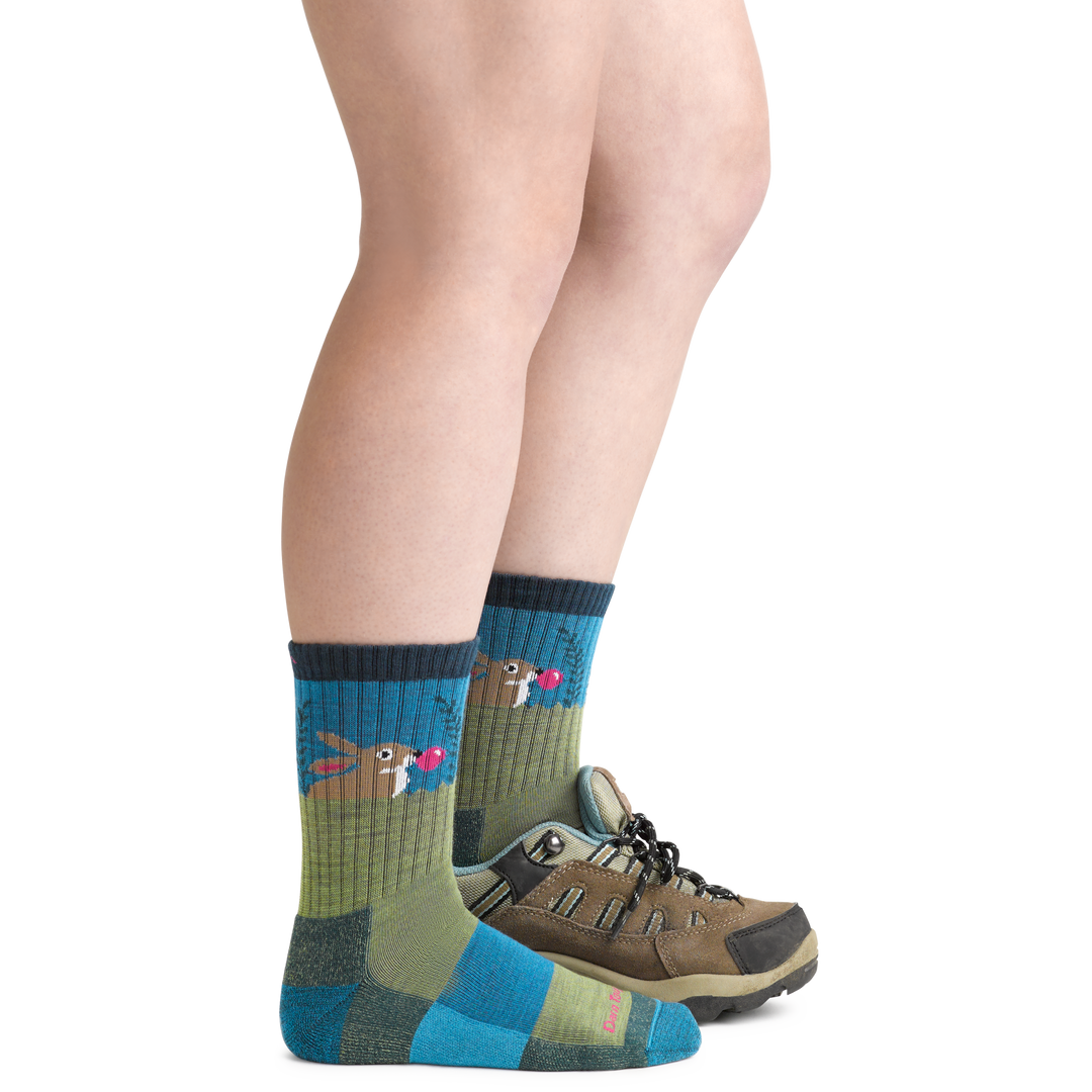 Bubble Bunny Jr. Kids' Hiking Socks in Willow green and blue wearing hiking boot