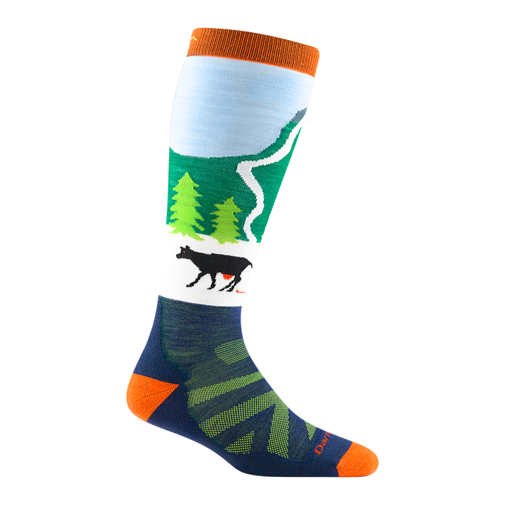 3036 kids pow cow over-the-calf ski sock in green with orange toe/heel accents, a black cow, and green tree design