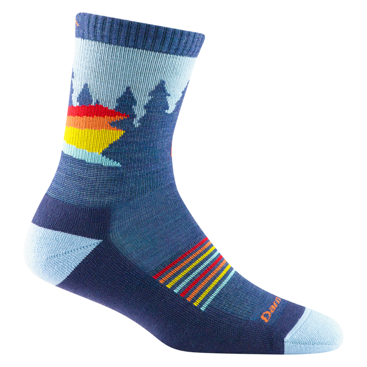 3037 kids van wild micro crew sock in color demin blue with tree silhouettes and red, orange, and yellow stripe details