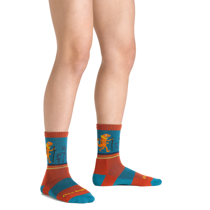 Sal Kids' Hiking Socks in lava colorway with red and blue on foot